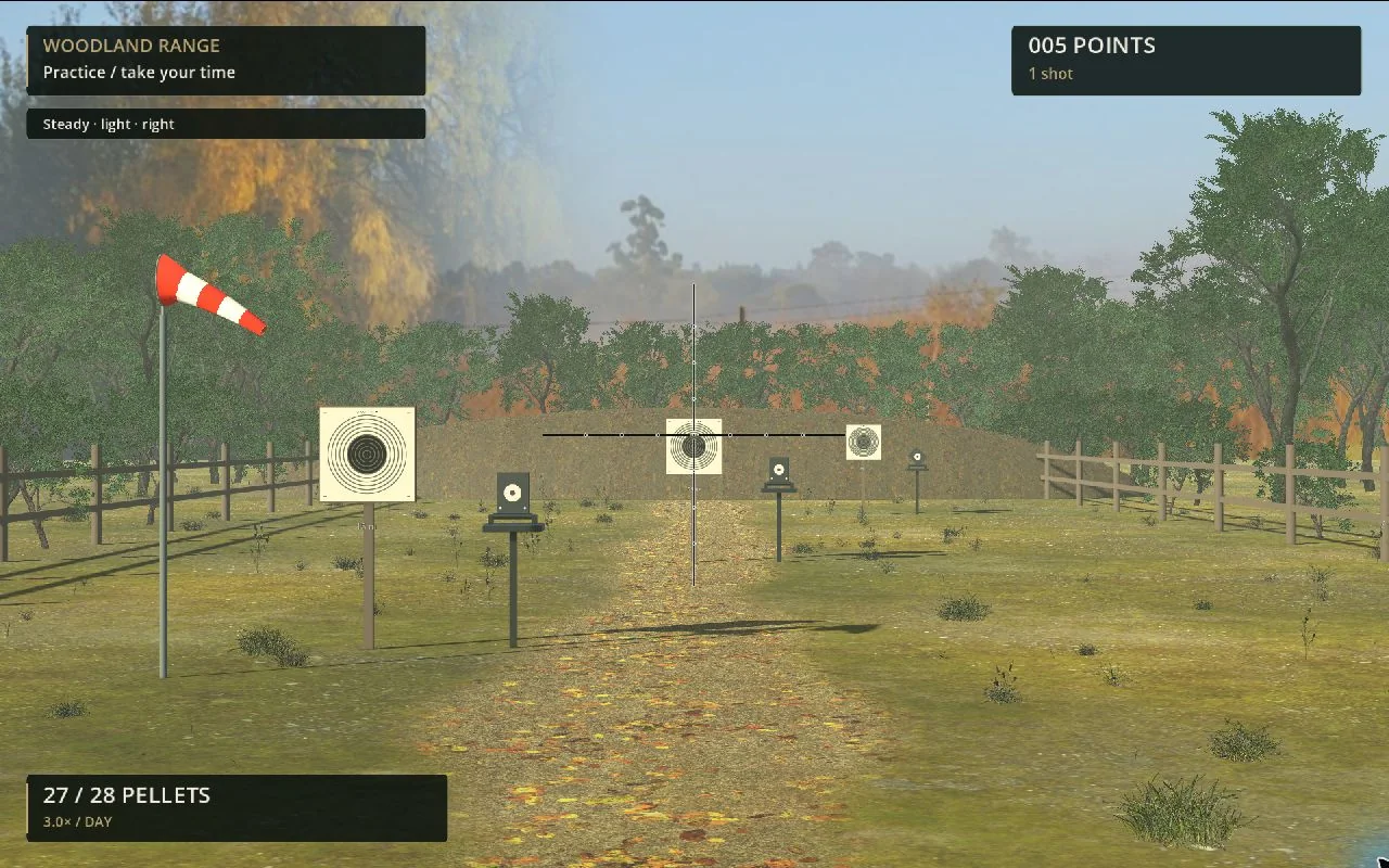 Scoped view of paper and silhouette targets at the Airgun shooting range, with the current windsock visible.